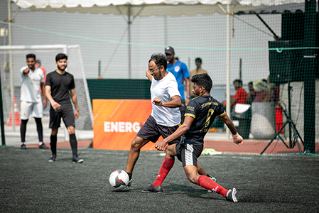 a game of football Embassy Energize